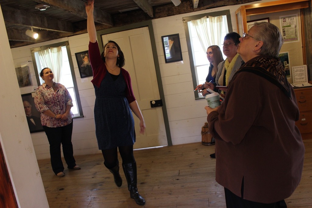Tour guide showing the historic Sheldon Peck Homestead museum. 