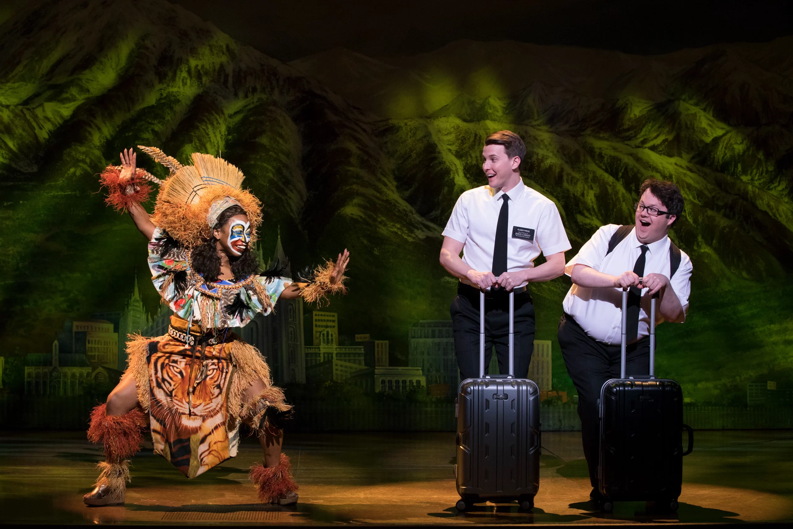 Destinee Rea as Mrs. Brown, Dave Thomas Brown as Elder Price, Cody Jamison Strand as Elder Cunningham in The Book of Mormon