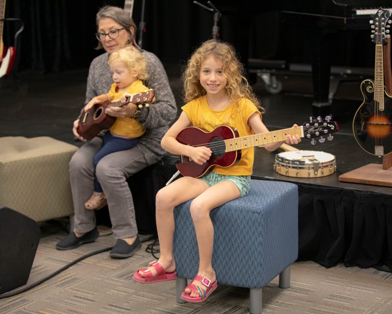 Museum of Making Music playing guitar. Photo credit Facebook 768x614