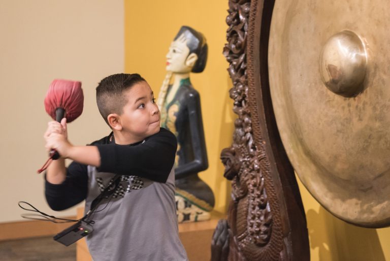 Musical Instrument Museum MIM gong playing. Photo credit Facebook 1 768x513