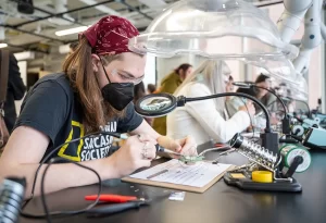 Real Life Field Trips - Rochester Institute of Technology (RIT) students learn to solder for real life experiences in STEM. Photo credit Rochester Institute of Technology Facebook