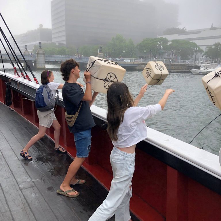 Boston Tea Party Ships Museum throwing tea 2. Photo credit Boston Tea Party Ships Museum Facebook 768x768