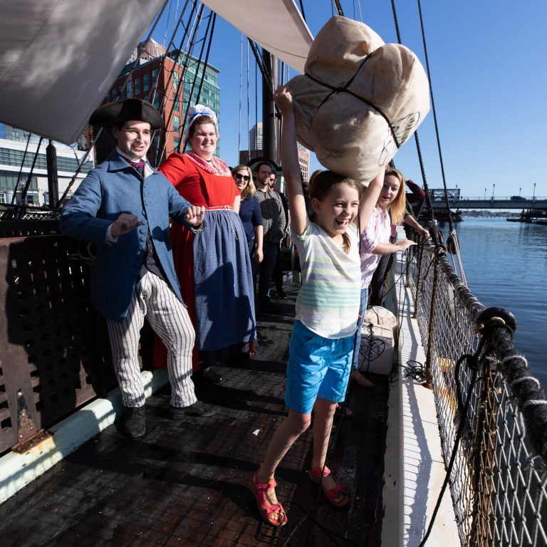 Boston Tea Party Ships Museum throwing tea. Photo credit Boston Tea Party Ships Museum Facebook 768x768
