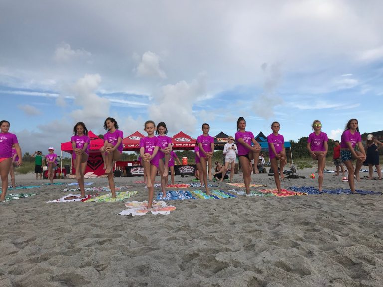 Ron Jon Surf Shop yoga on the beach. Photo credit Ron Jon Surf Shop Cocoa Beach Facebook 768x576