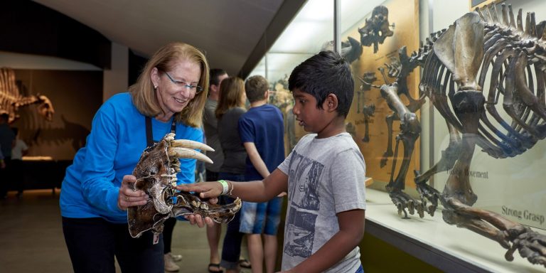 La Brea Tar Pits and Museum student with a museum guide. Photo credit La Brea Tar Pits and Museum Facebook 768x384