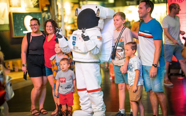 Space Center Houston posing with an astronaut. Photo credit Space Center Houston Facebook 768x480