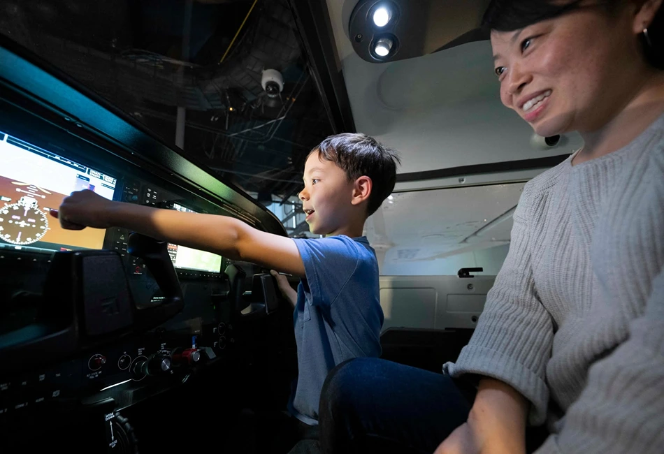 Smithsonian's interactive simulators let students take flight using the yoke and pedals. Credit - National Air and Space Museum Facebook